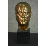 A 20th century bronze head of a gentleman, mounted on a black marble base. H.48 W.18 D.23cm.