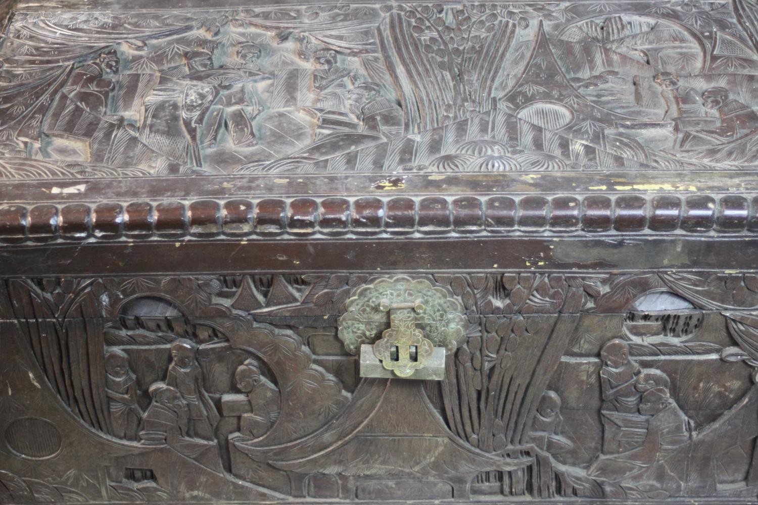 An early 20th century Chinese camphorwood chest, the exterior carved allover with figures amongst - Image 7 of 11