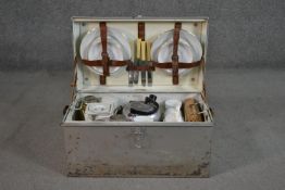 A 1930s Garrison four place picnic set with original fittings in aluminium case. H.26 W.54 D.31cm