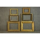 A collection of six picture frames, including four carved giltwood and gesso frames with various