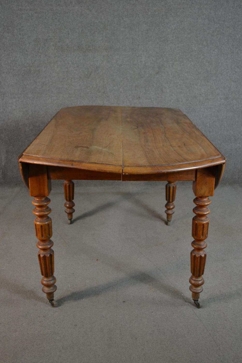 A Victorian figured walnut drop leaf dining table, the circular top with a moulded edge, on - Image 2 of 6