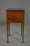 A Sheraton style Edwardian mahogany and inlaid work table, the rectangular top opening to reveal a