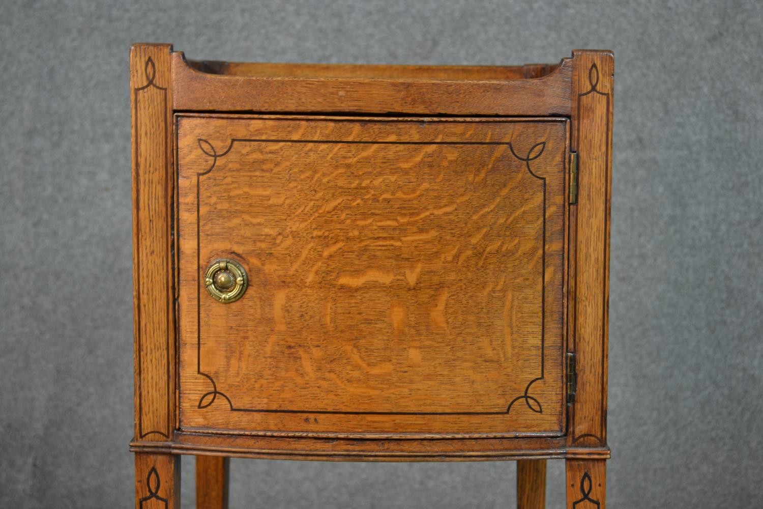 A George III style oak and inlaid bedside cabinet, the gallery top with handles, over a cupboard - Image 6 of 7