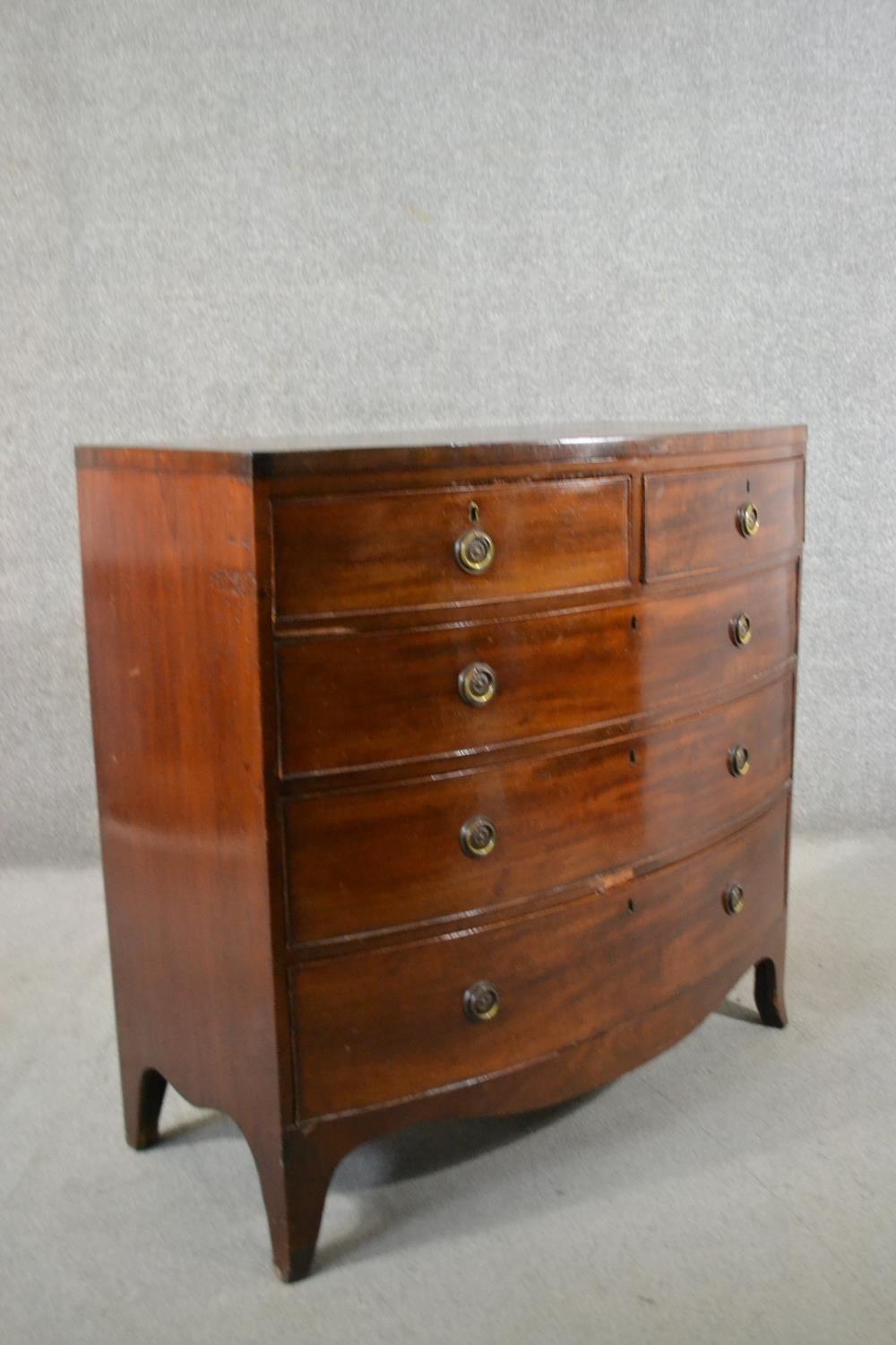 A George III mahogany bow front chest, of two short over three long graduated drawers, above a - Image 2 of 6