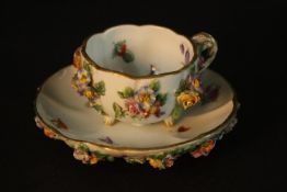 A late 19th century Meissen porcelain cabinet cup and saucer of lobed circular form with
