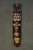 A vintage carved and painted Native American totem. H.90 W.18 D.8cm.