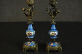 A pair of Sevres style bleu celeste porcelain garniture candlesticks, with gilt metal mounts, the