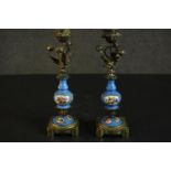 A pair of Sevres style bleu celeste porcelain garniture candlesticks, with gilt metal mounts, the