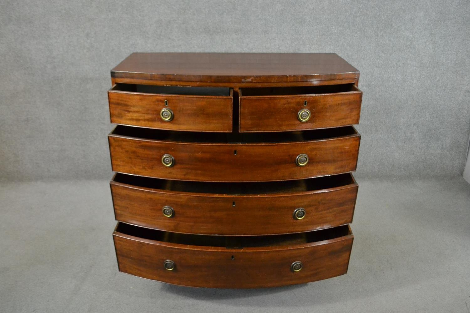A George III mahogany bow front chest, of two short over three long graduated drawers, above a - Image 5 of 6