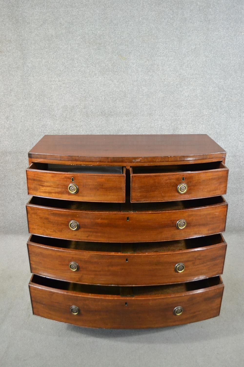 A George III mahogany bow front chest, of two short over three long graduated drawers, above a - Image 4 of 6