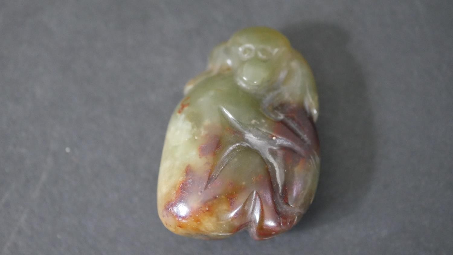 A Chinese carved jade monkey pendant along with a Chinese porcelain fragment and silver plated - Image 3 of 5