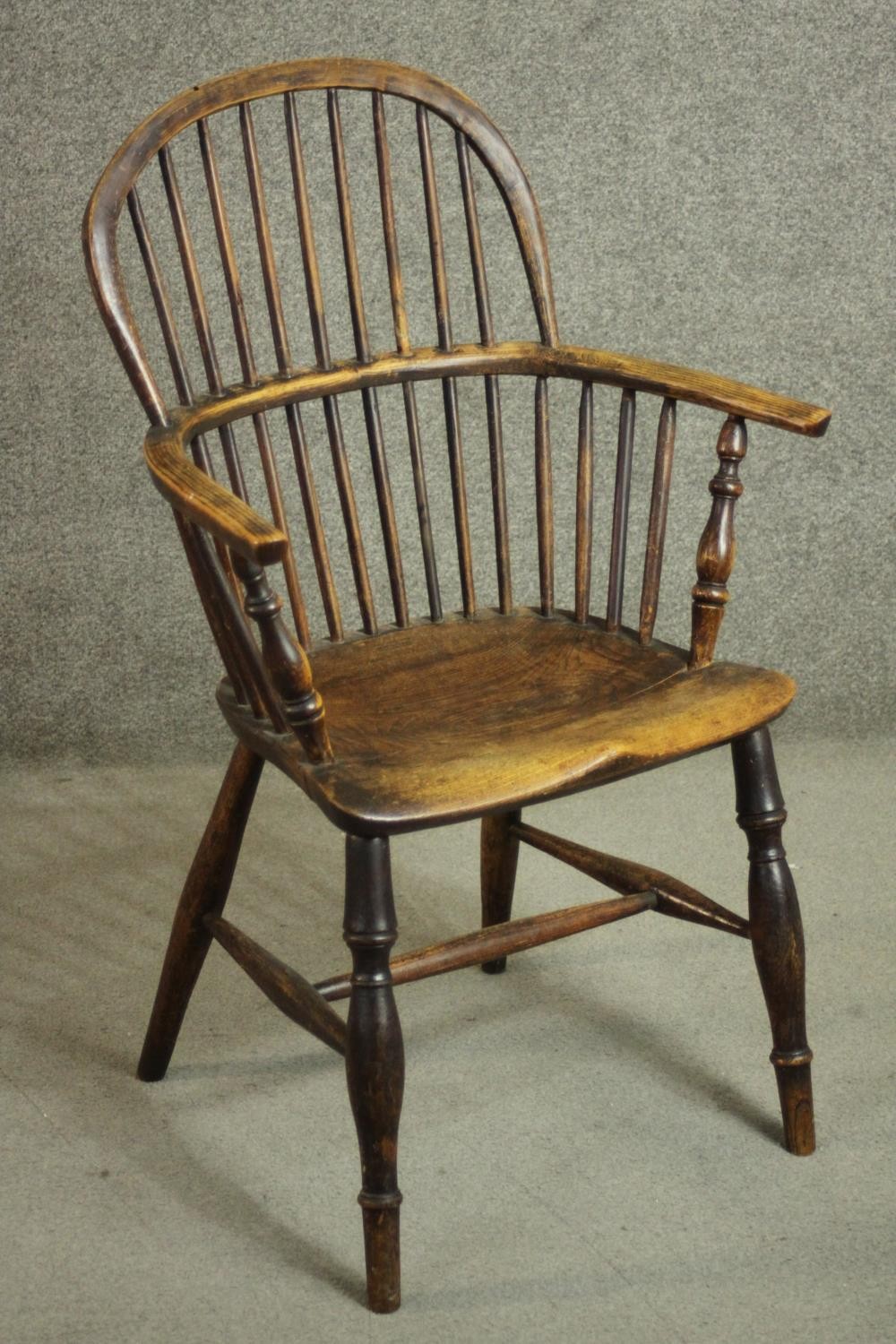 A 19th century ash hoop back Windsor armchair, with an elm seat, on turned legs joined by an H - Image 2 of 6