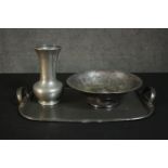 A collection of pewter ware, including a twin handled hammered effect pewter tray, a vase and bowl