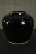 A large Chinese black ware ceramic jar. H.25cm.