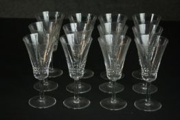 A set of twelve hand cut crystal wine glasses with trumpet shape. H.16 Dia.6cm.