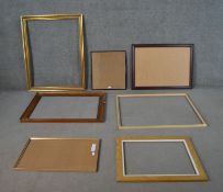 A collection of picture frames, including a gilt example, a mahogany frame, two oak frames, and