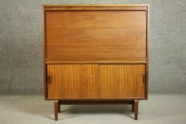 A circa 1960s teak bureau, by Beaver & Tapley Ltd, Multi-Width Fitting Furniture, with a fall