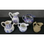 A collection of 19th century ceramic jugs, including a Samuel Alcock lilac relief design wine jug, a