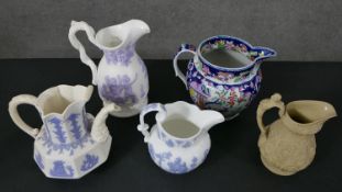 A collection of 19th century ceramic jugs, including a Samuel Alcock lilac relief design wine jug, a