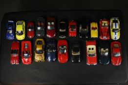A collection of approximately fifty three vintage tin plate cars and other vehicles. Makes including