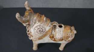 A terracotta Peruvian folk art jug in the form of a bull with hand painted white glaze design. L.