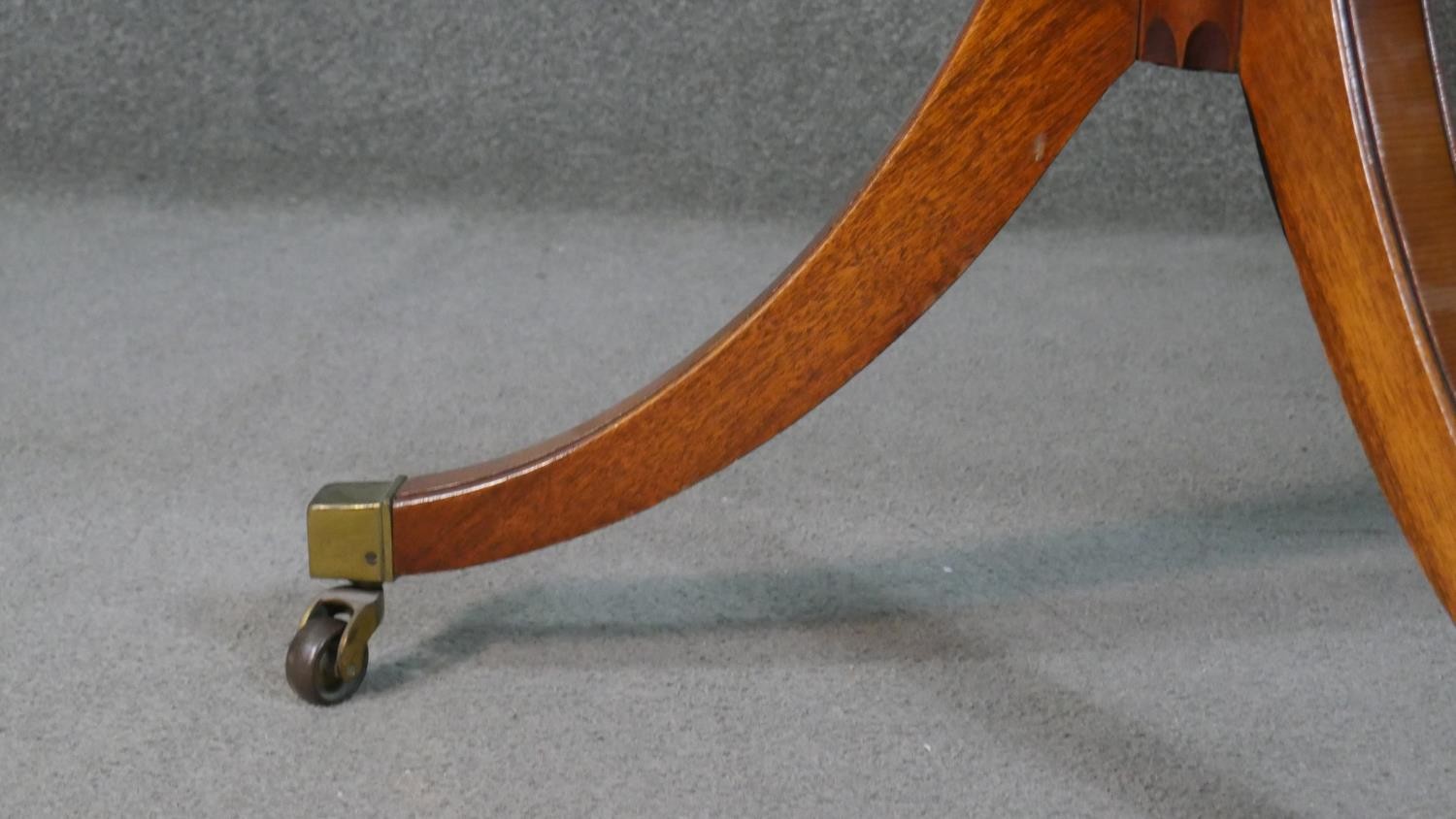 A George III style yew wood D-end dining table, with a cross banded top and additional leaf, on - Image 6 of 9