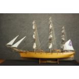 A scratch built model of the Cutty Sark tea clipper, on stand. H.78 W.120 D.19cm.