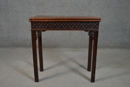 A Georgian mahogany Chippendale style card table, the rectangular fold over top with baize lined
