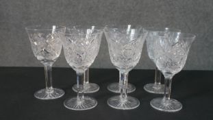 A set of seven hand cut sherry glasses with a star cut bases. H.17 Diam.10cm