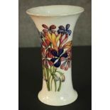 A large Moorcroft vase of waisted flared form decorated in the Spring Flowers pattern with sprays of