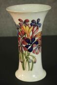 A large Moorcroft vase of waisted flared form decorated in the Spring Flowers pattern with sprays of