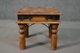 An Indian Sheesham occasional coffee table, the square top with iron studs, on turned legs with iron