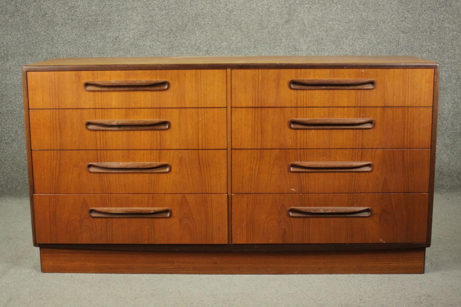 Victor Wilkins for G-Plan, a circa 1970s teak Fresco chest of two banks of four drawers, on a plinth