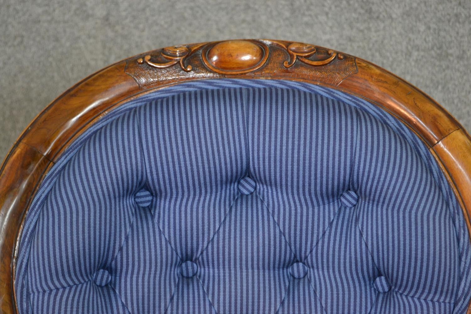 A Victorian walnut spoon back open armchair, upholstered in striped blue fabric, to the arms, seat - Image 7 of 7