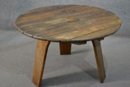 A Hattersley Keighley rustic teak garden table, with a slatted circular top, on three splayed