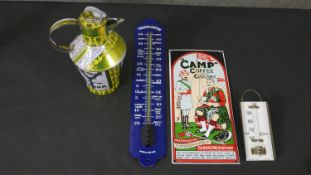 A two vintage thermometers, one blue enamel and the other white glass, stamped Kodak along with a