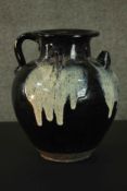 A Chinese black ware ceramic ewer with splashes. H.31cm.