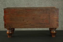 A stained pine cuboid box, with a sliding lid, lined with green baize, on turned feet. H.30 W.30 D.