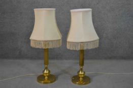 A pair of vintage brass fluted column design table lamps with cream silk shades. H.85cm