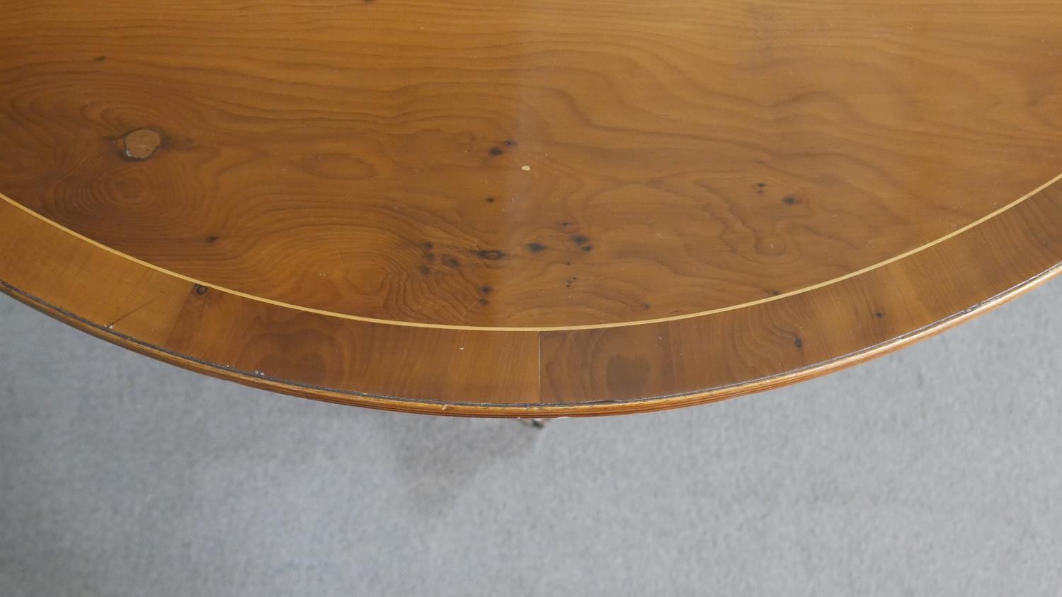 A George III style yew wood D-end dining table, with a cross banded top and additional leaf, on - Image 9 of 9