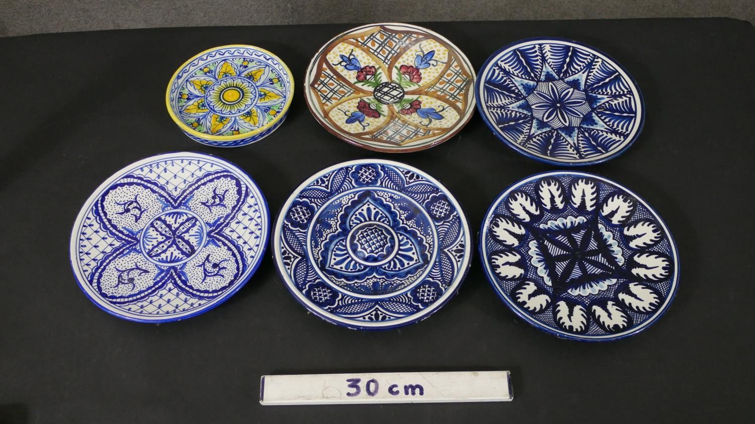 A collection of six majolica ceramic hand painted chargers, each with a different design, some - Image 2 of 6