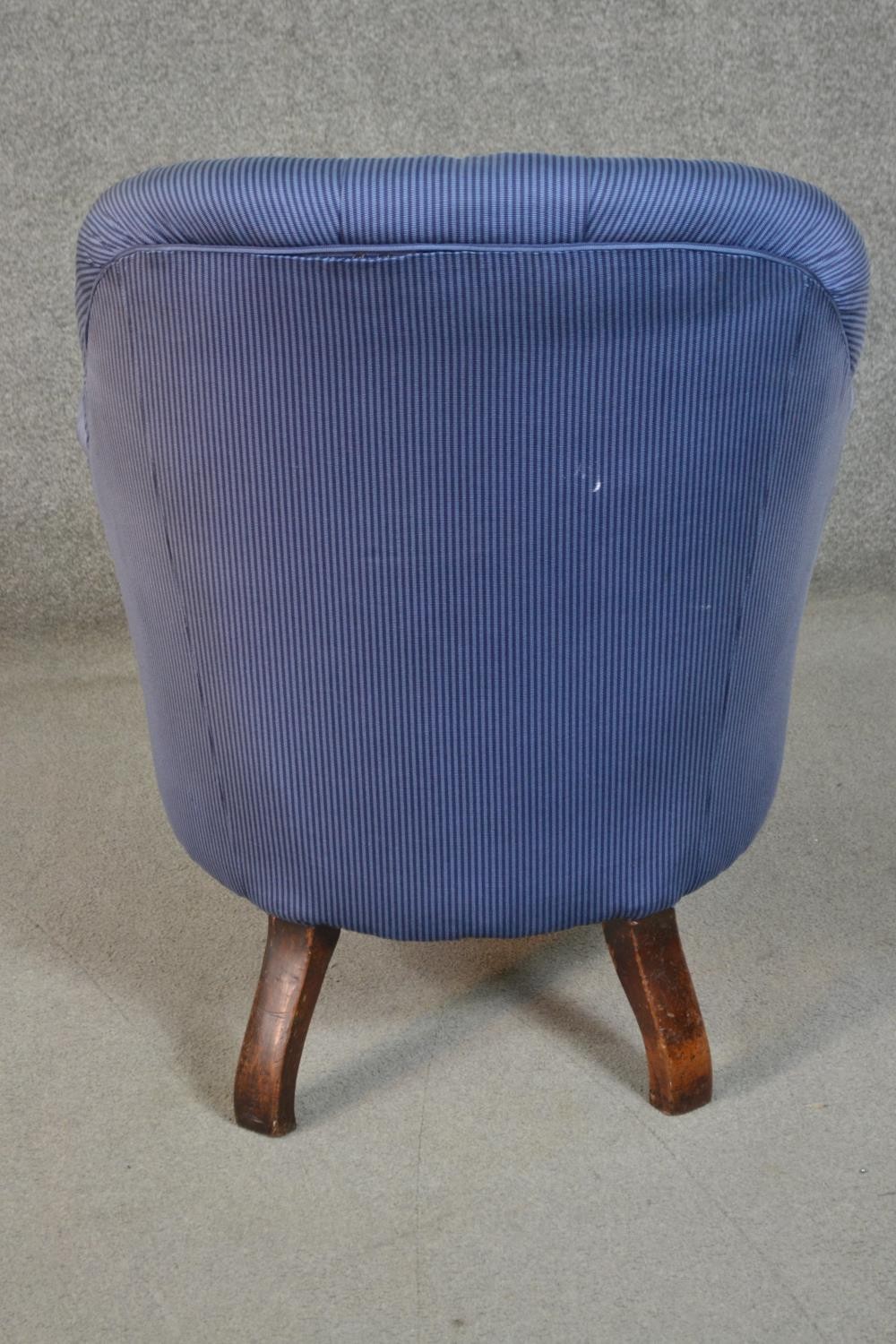 A circa 1830s mahogany tub armchair, upholstered in striped blue fabric, with a button back, the - Image 4 of 7