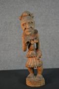 An early 20th century carved African Tribal statue. H.42cm