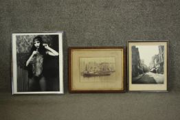 Three framed and glazed black and white photographs. One of an Art Deco dancer, one of a street