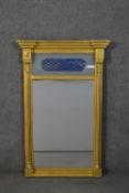 A William IV gilt pier mirror, with a painted panel over a rectangular mirror plate, flanked by