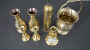 A collection of early 20th century brass ware, including a Turkish Coffee grinder, three candle