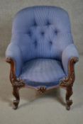 A circa 1830s mahogany tub armchair, upholstered in striped blue fabric, with a button back, the