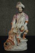 A 19th century Staffordshire pottery figure 'The Lion Slayer', painted, on an ovoid base. H.39.5cm.