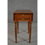 A Victorian mahogany drop leaf work table, the top with a moulded edge, over two drawers, on