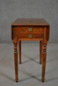 A Victorian mahogany drop leaf work table, the top with a moulded edge, over two drawers, on